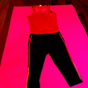 Red /Black work out top and black with red/grey strip on Capri work out pant